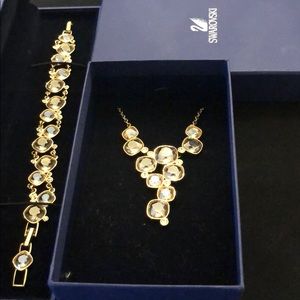 Swarovski brand necklace and bracelet set.